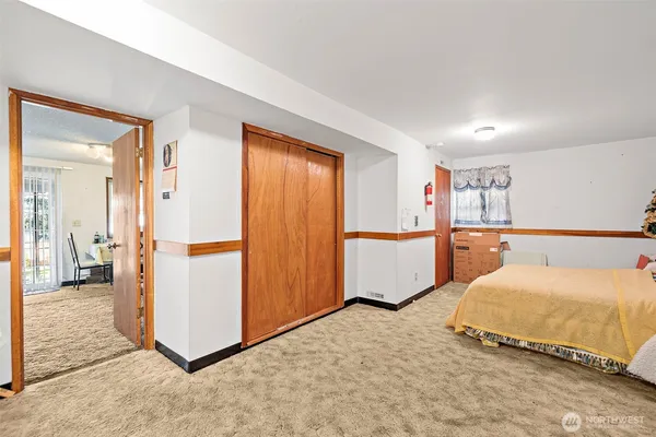 a bedroom with a bed and a cabinets