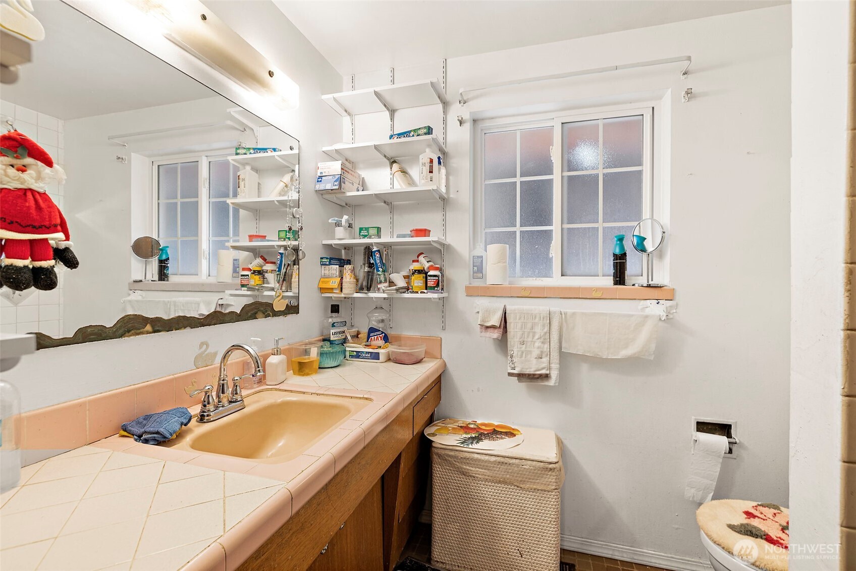 8829 20th Avenue Southwest Seattle, WA 98106 - Photo 14 of 40 a room with a sink and a bed