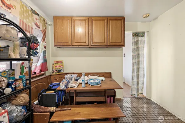 a room with furniture and a potted plant
