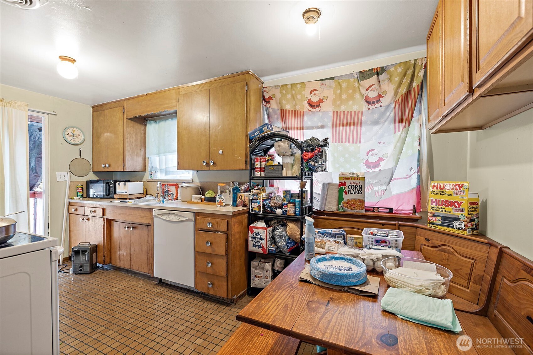 8829 20th Avenue Southwest Seattle, WA 98106 - Photo 17 of 40 a kitchen with stainless steel appliances wooden floor and sink