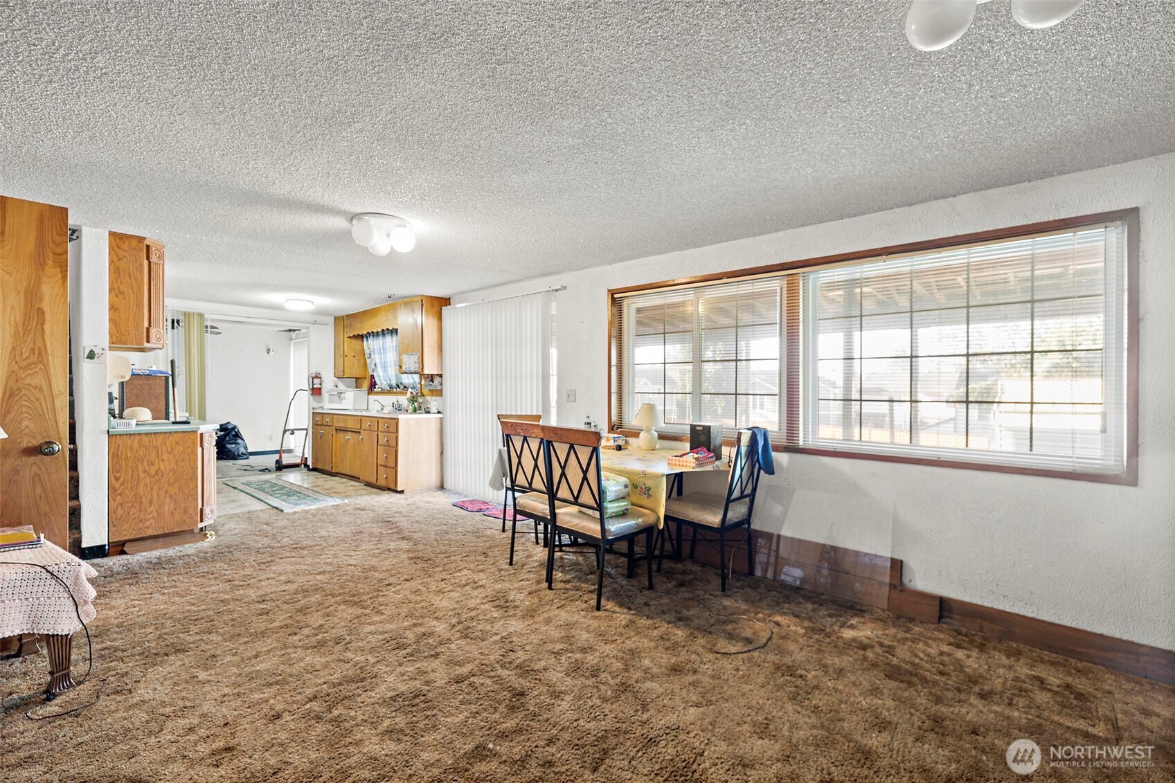 8829 20th Avenue Southwest Seattle, WA 98106 - Photo 25 of 40 a view of a workspace with furniture and a window