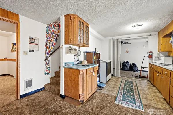 a kitchen with stainless steel appliances granite countertop a stove and a sink