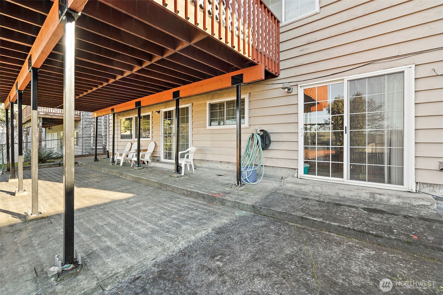 8829 20th Avenue Southwest Seattle, WA 98106 - Photo 33 of 40 a view of a porch with a table and chairs