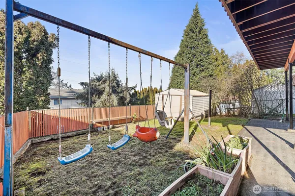 a backyard of a house with barbeque oven