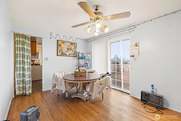 a view of a dining room with furniture window and wooden floor
