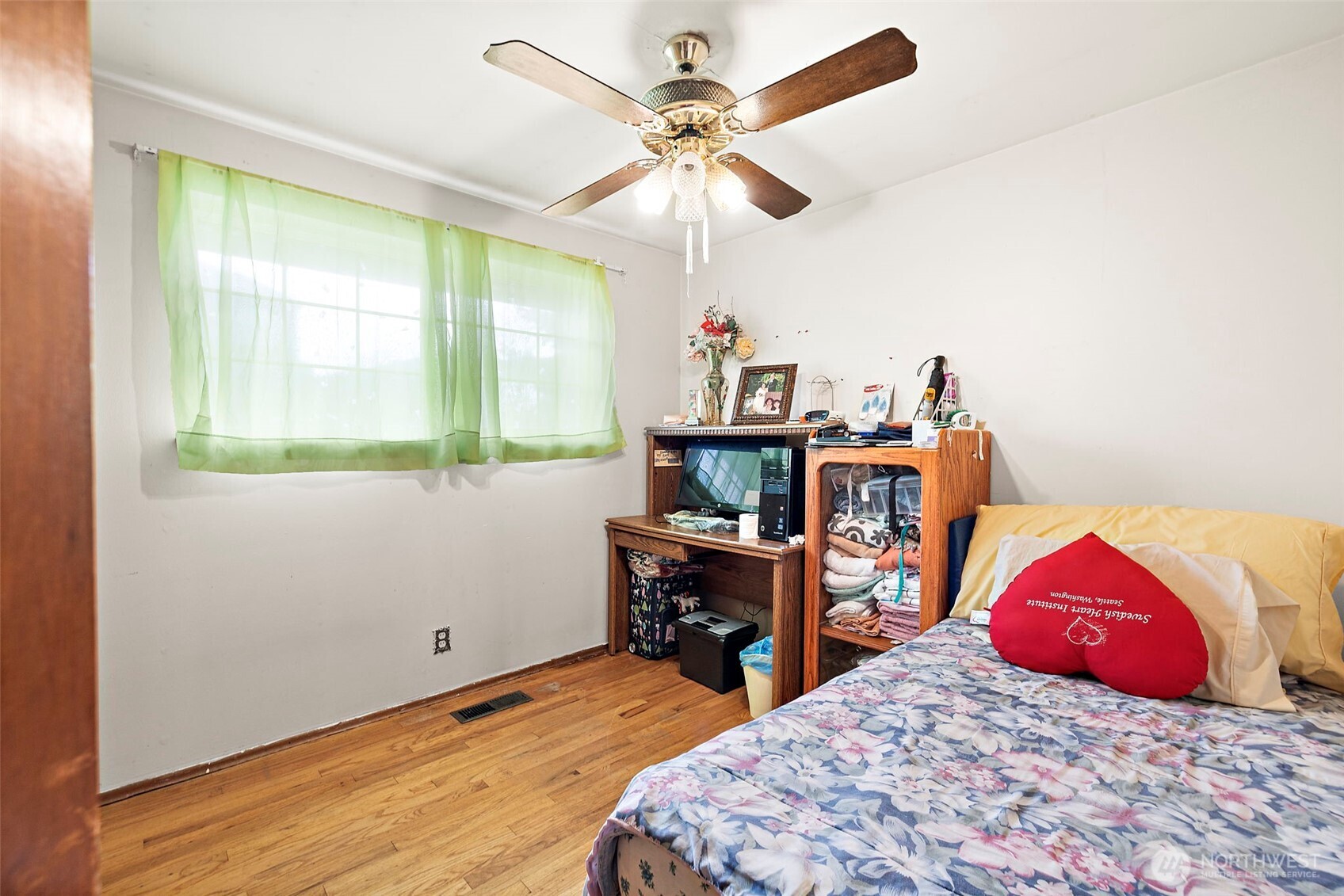 8829 20th Avenue Southwest Seattle, WA 98106 - Photo 10 of 40 a bedroom with bed and a chandelier
