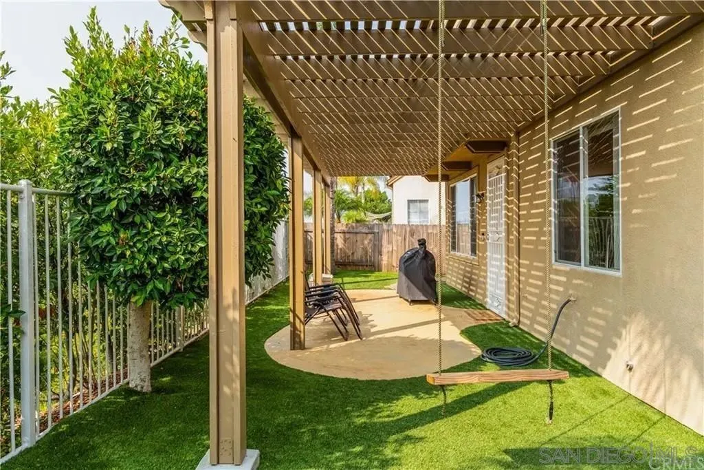 531 Poets Square Fallbrook, CA 92028 - Photo 18 of 19 a view of a house with backyard and sitting area