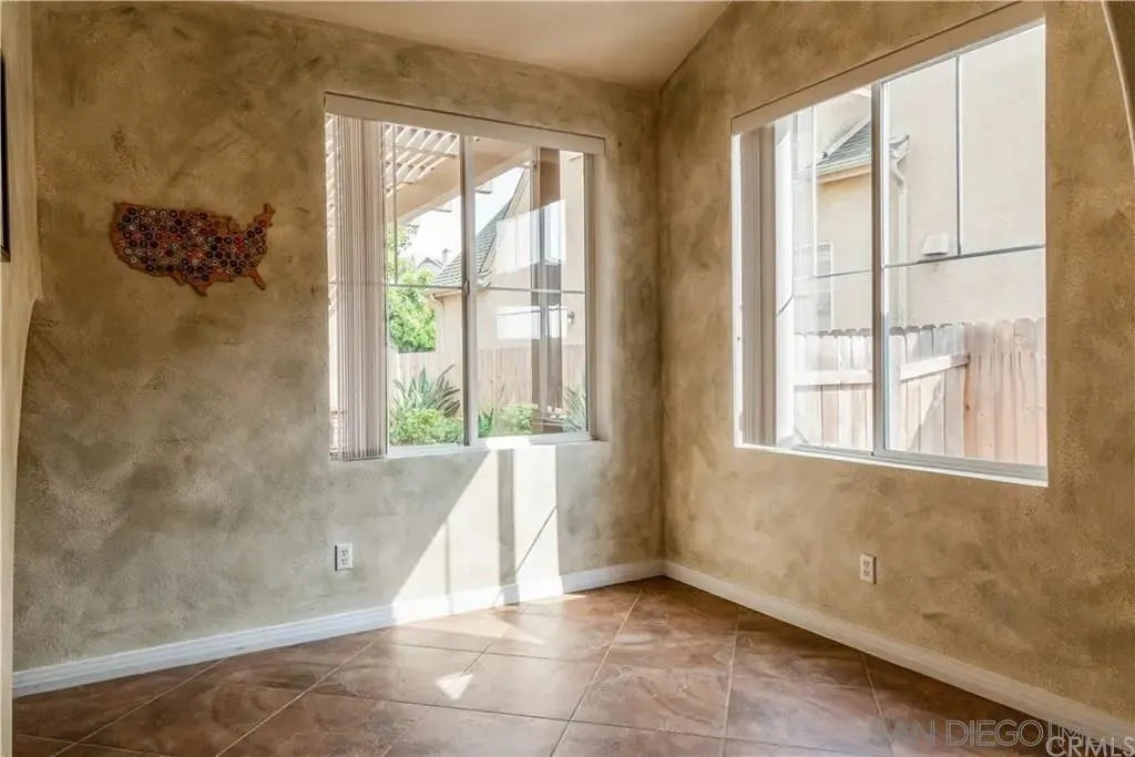 531 Poets Square Fallbrook, CA 92028 - Photo 7 of 19 a view of an empty room with a window