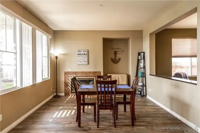 a view of a dining room with furniture and window
