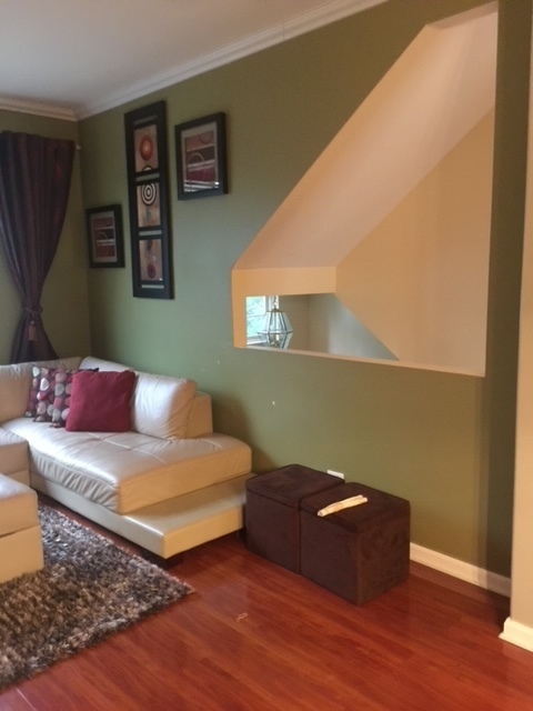 3493 Ravinia Circle, Unit 3493 Aurora, IL 60504 - Photo 4 of 18 a living room with hard wood flooring and a couch
