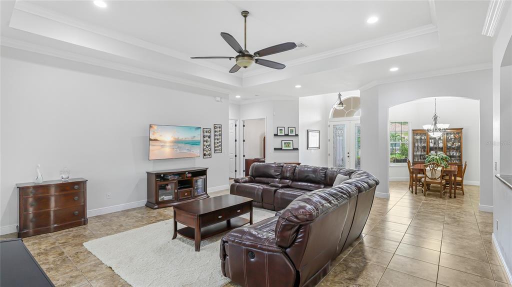 5621 Rock Dove Drive Sarasota, FL 34241 - Photo 11 of 49 a living room with furniture kitchen view and a chandelier
