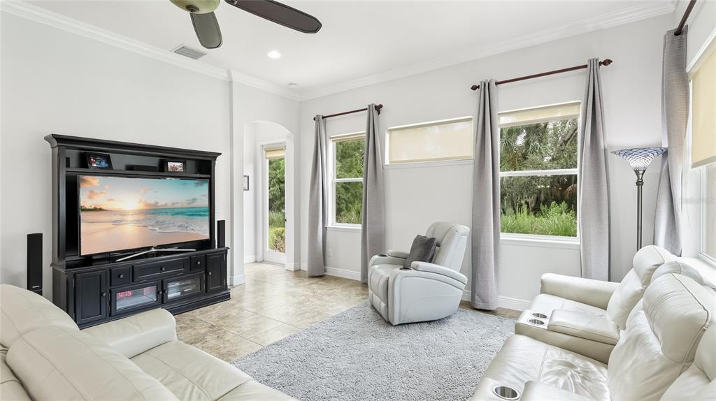 5621 Rock Dove Drive Sarasota, FL 34241 - Photo 18 of 49 a living room with furniture and a flat screen tv