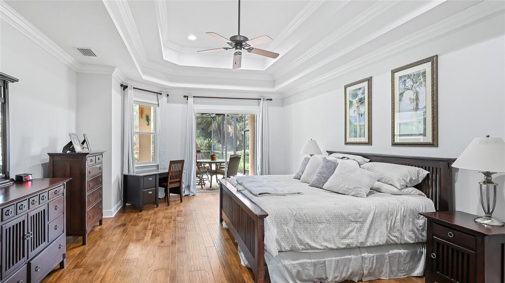 5621 Rock Dove Drive Sarasota, FL 34241 - Photo 19 of 49 a bedroom with a bed and a chandelier