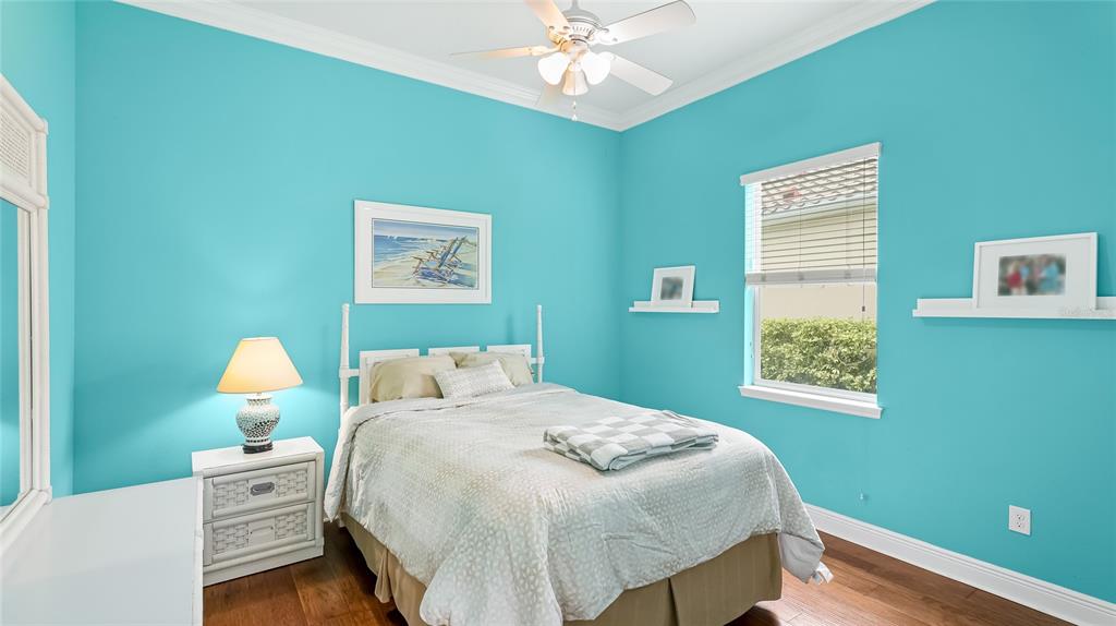 5621 Rock Dove Drive Sarasota, FL 34241 - Photo 24 of 49 a bedroom with a bed and chandelier