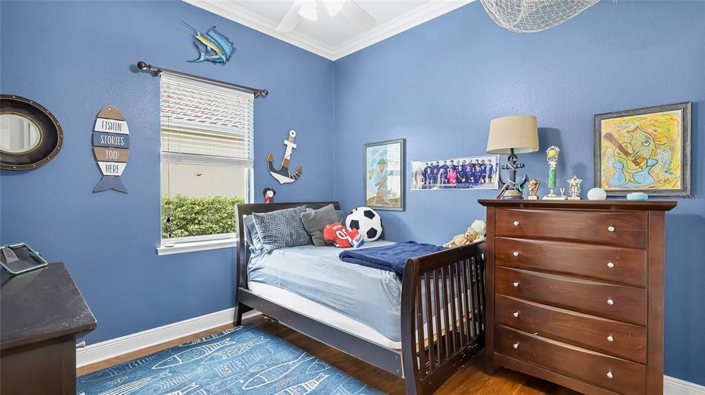 5621 Rock Dove Drive Sarasota, FL 34241 - Photo 28 of 49 a bedroom with a bed and a chandelier