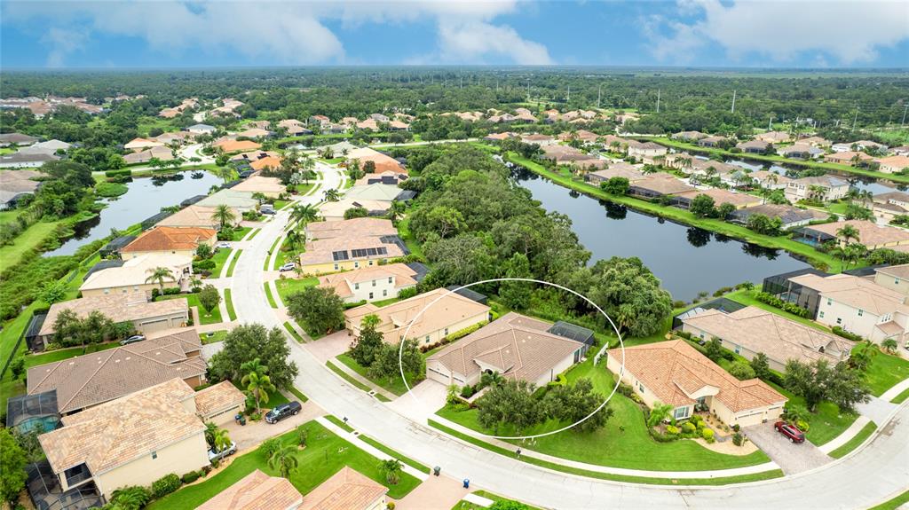 5621 Rock Dove Drive Sarasota, FL 34241 - Photo 3 of 49 an aerial view of residential houses with outdoor space