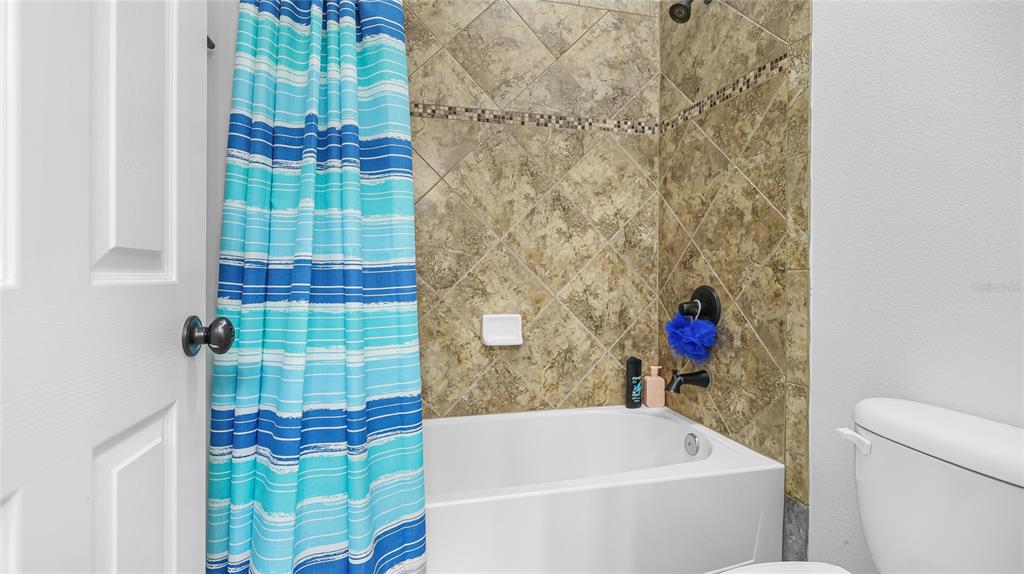 5621 Rock Dove Drive Sarasota, FL 34241 - Photo 31 of 49 a bathroom with a bathtub and shower