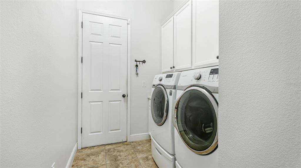 5621 Rock Dove Drive Sarasota, FL 34241 - Photo 35 of 49 a utility room with dryer and washer
