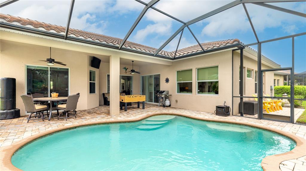 5621 Rock Dove Drive Sarasota, FL 34241 - Photo 4 of 49 a view of a house with swimming pool and sitting area