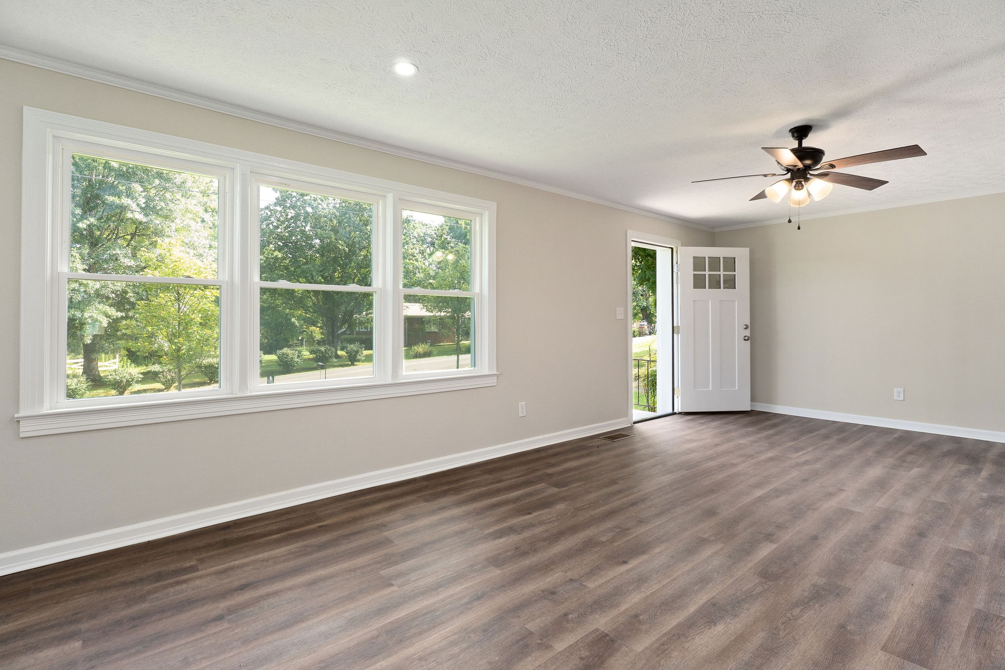 218 Roosevelt Road McMinnville, TN 37110 - Photo 12 of 31 a view of empty room with wooden floor and fan