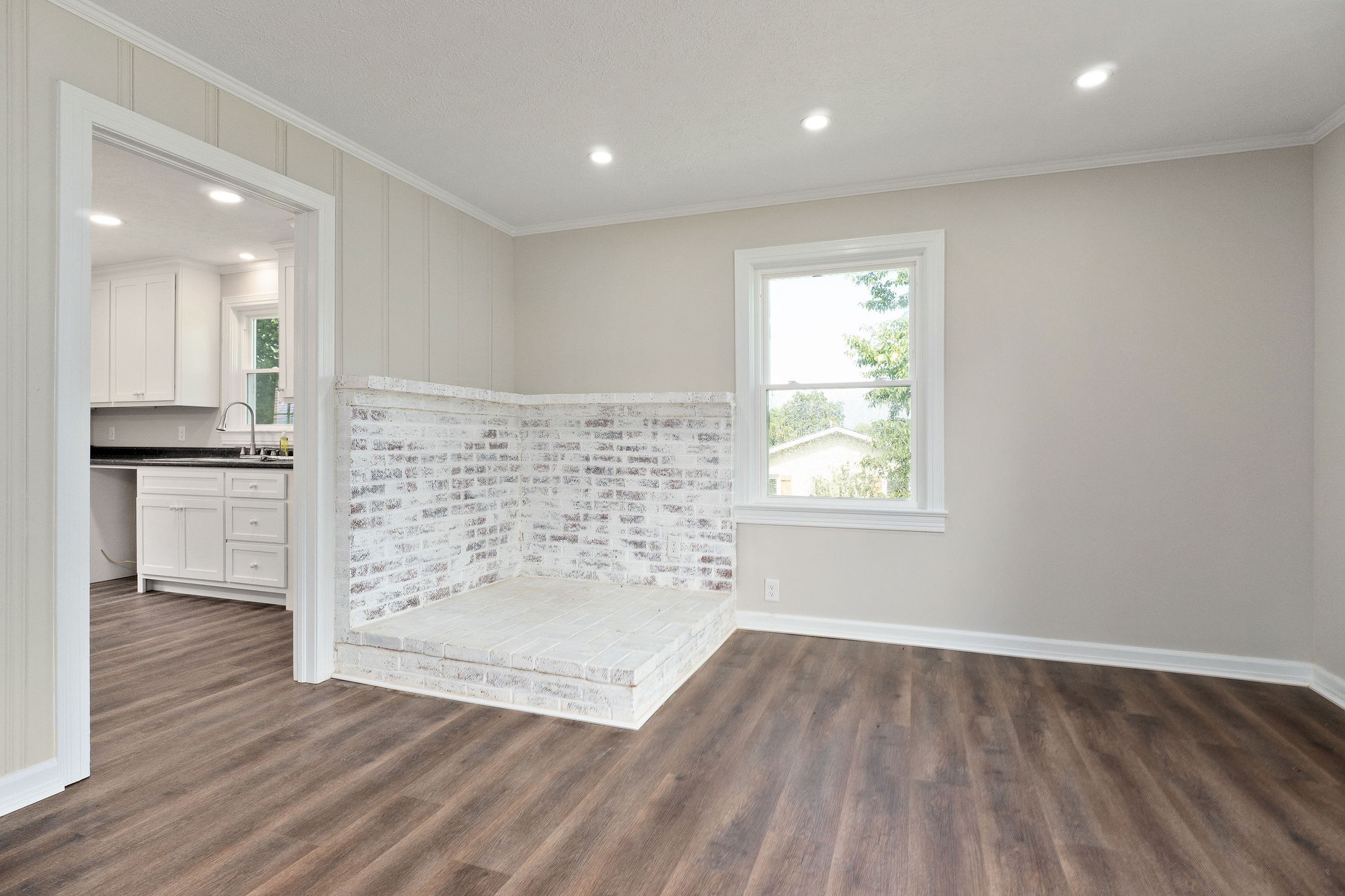 218 Roosevelt Road McMinnville, TN 37110 - Photo 13 of 31 an empty room with wooden floor cabinet and windows