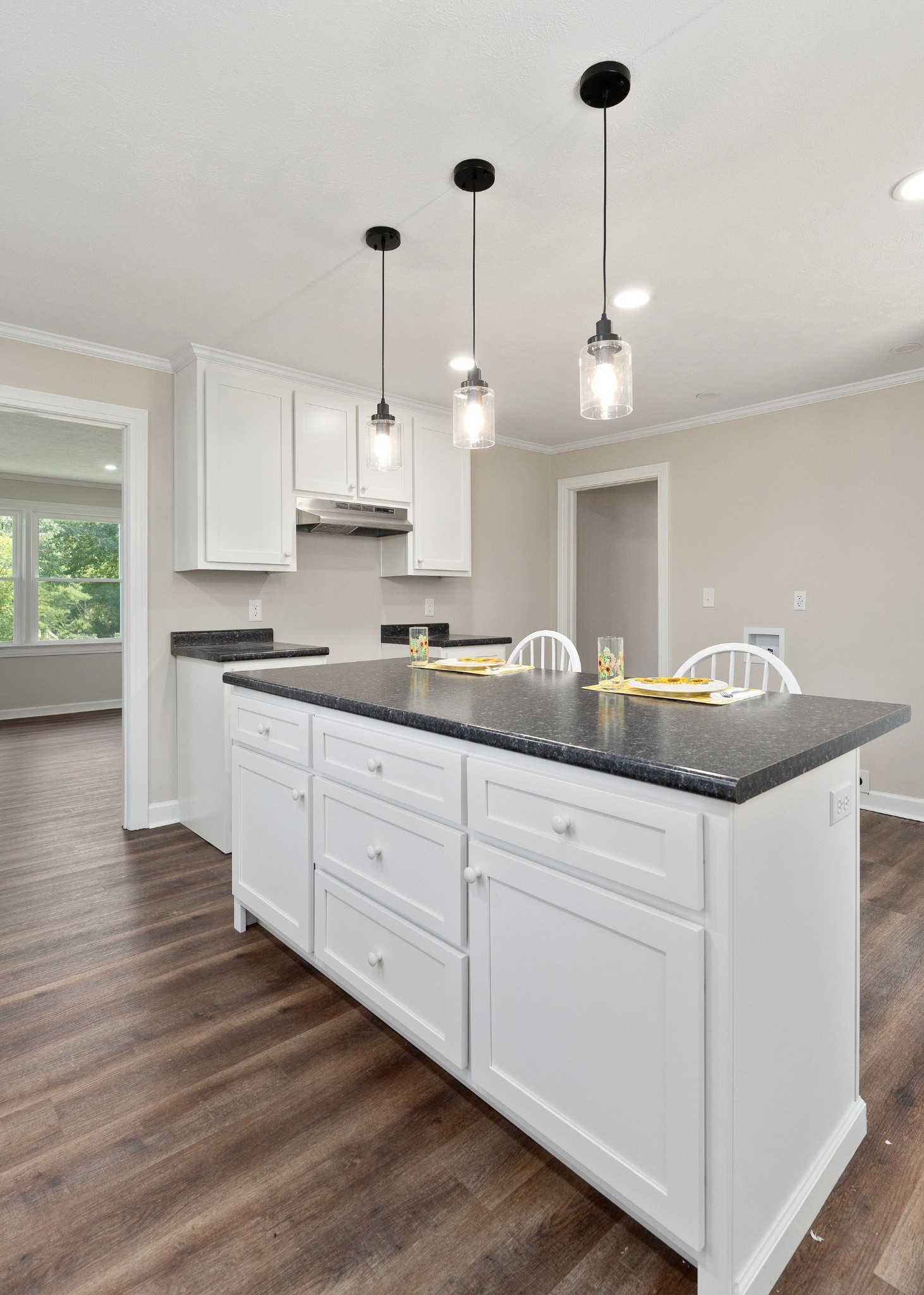 218 Roosevelt Road McMinnville, TN 37110 - Photo 17 of 31 a kitchen with granite countertop a sink cabinets and wooden floor