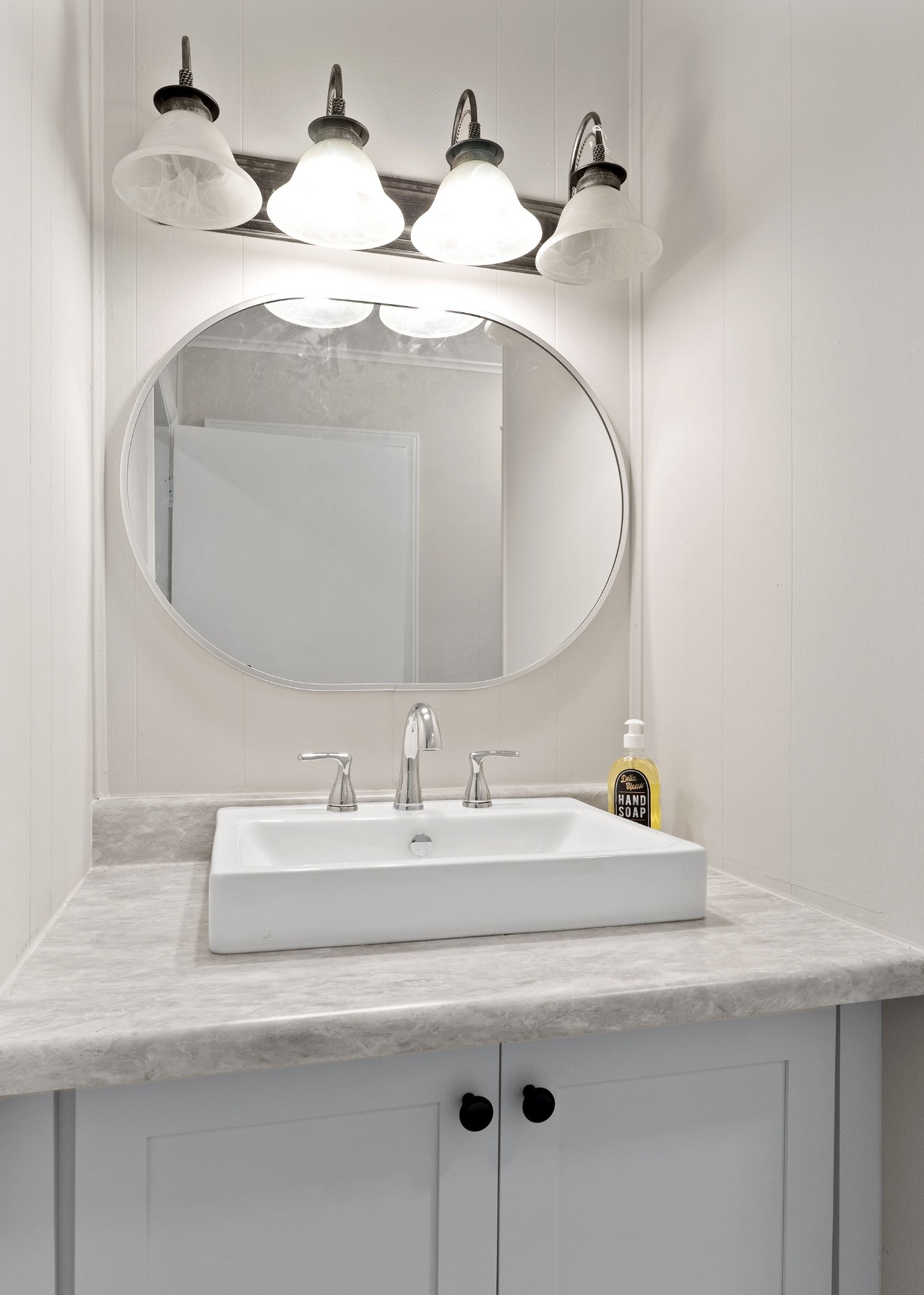 218 Roosevelt Road McMinnville, TN 37110 - Photo 21 of 31 a bathroom with a sink and a mirror