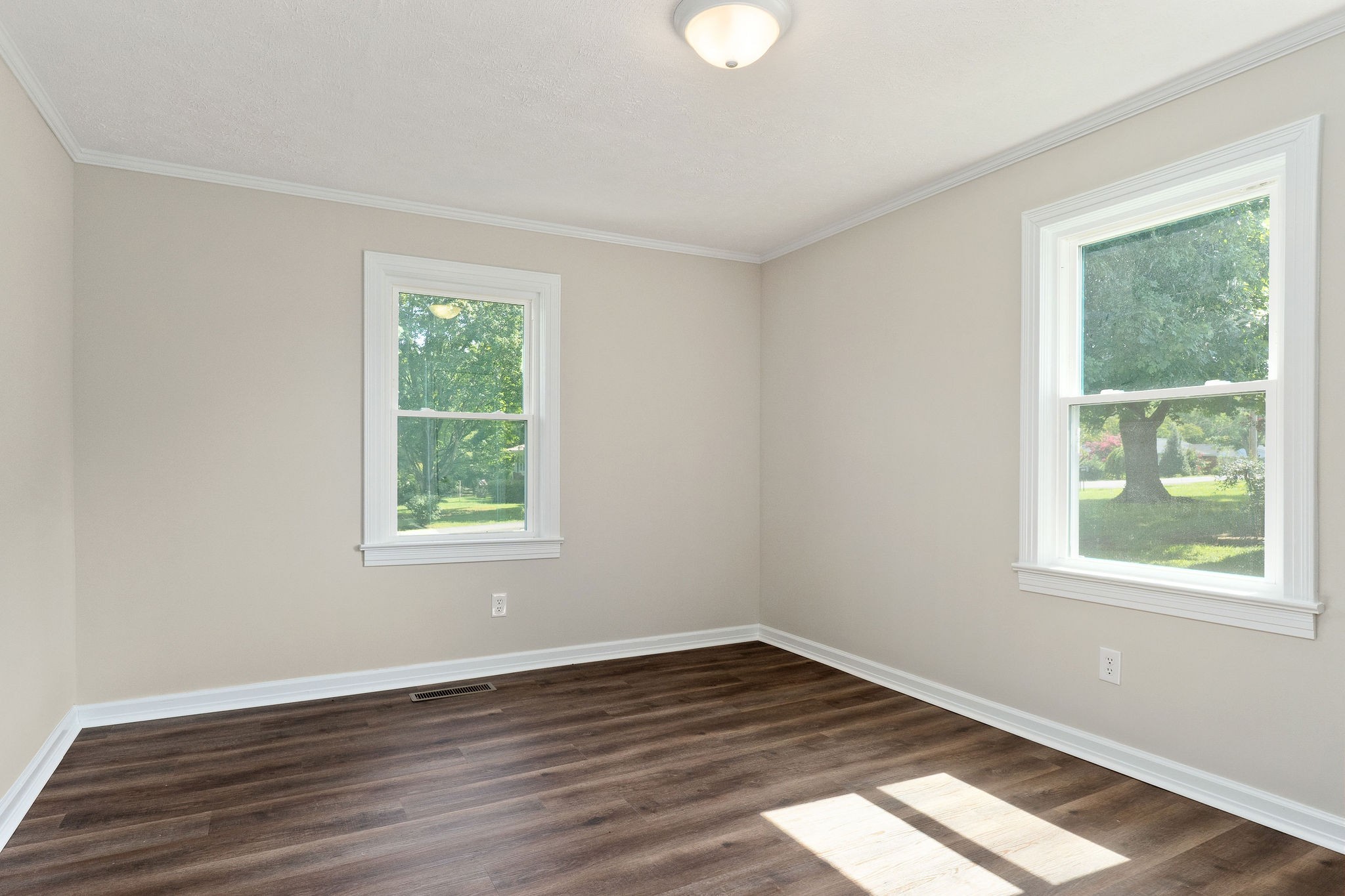 218 Roosevelt Road McMinnville, TN 37110 - Photo 24 of 31 a view of an empty room with wooden floor and a window