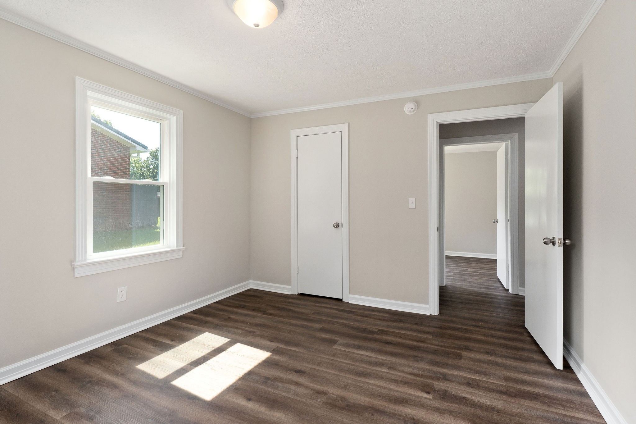 218 Roosevelt Road McMinnville, TN 37110 - Photo 25 of 31 a view of an empty room with wooden floor and a window