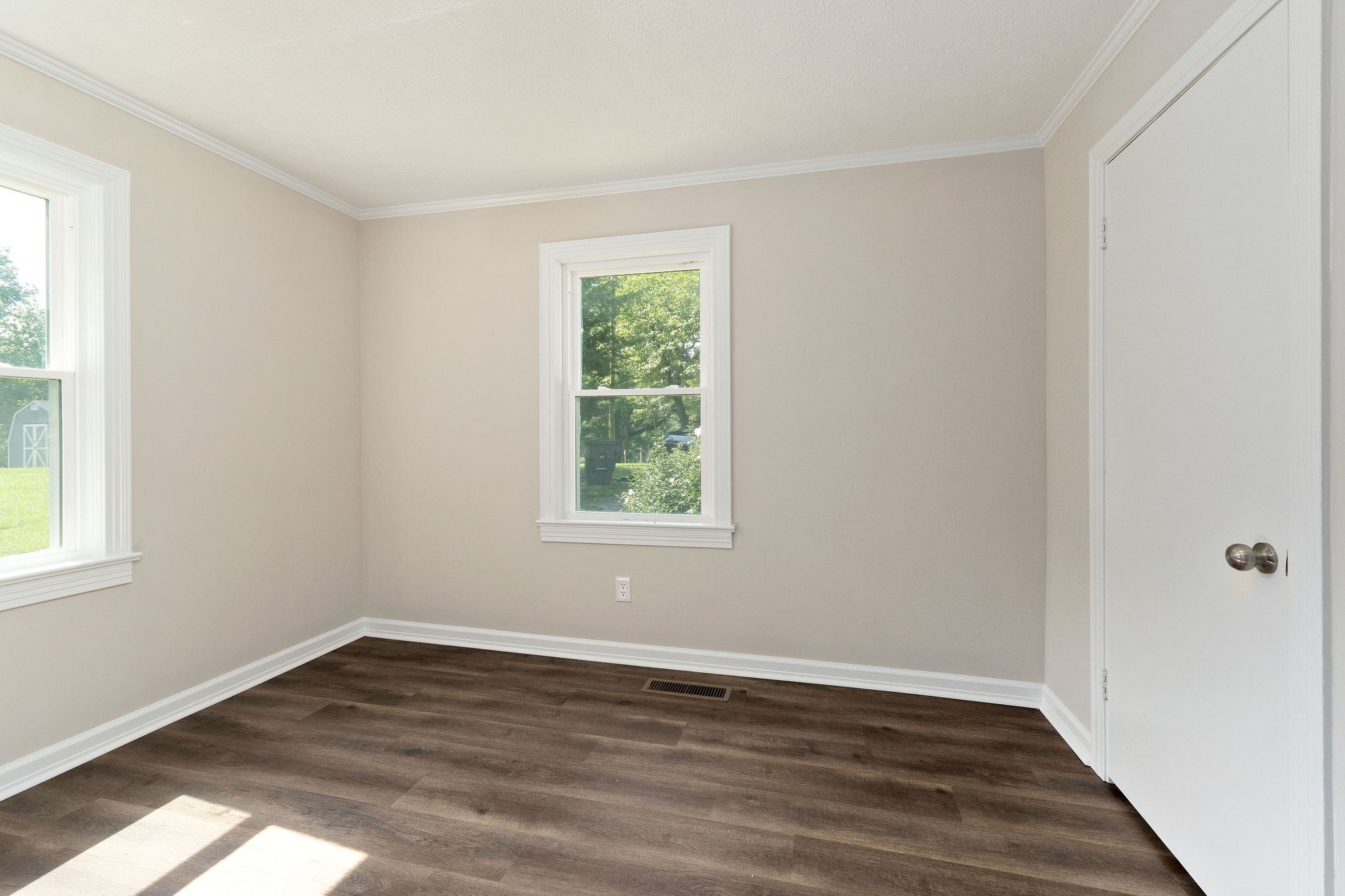 218 Roosevelt Road McMinnville, TN 37110 - Photo 26 of 31 a view of an empty room with wooden floor and a window
