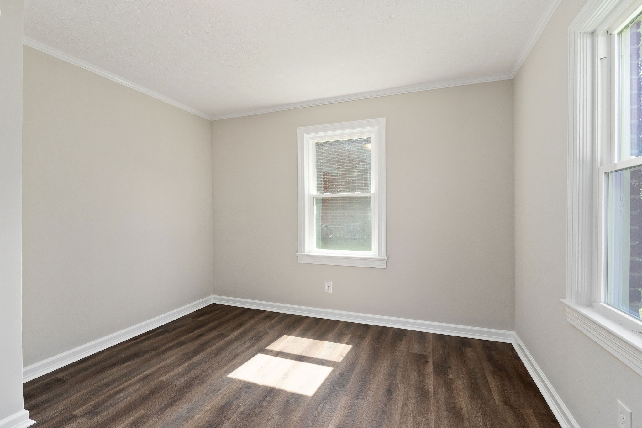 218 Roosevelt Road McMinnville, TN 37110 - Photo 27 of 31 an empty room with wooden floor and windows