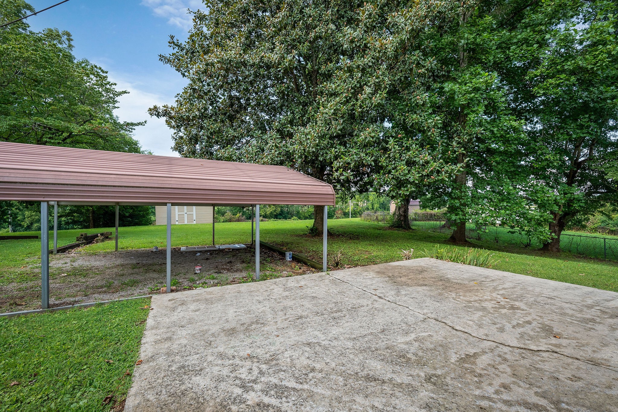218 Roosevelt Road McMinnville, TN 37110 - Photo 7 of 31 a view of a house with backyard and a tree