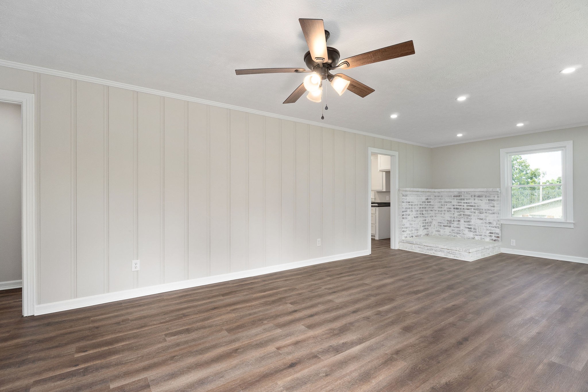 218 Roosevelt Road McMinnville, TN 37110 - Photo 8 of 31 a view of an empty room with wooden floor and a window