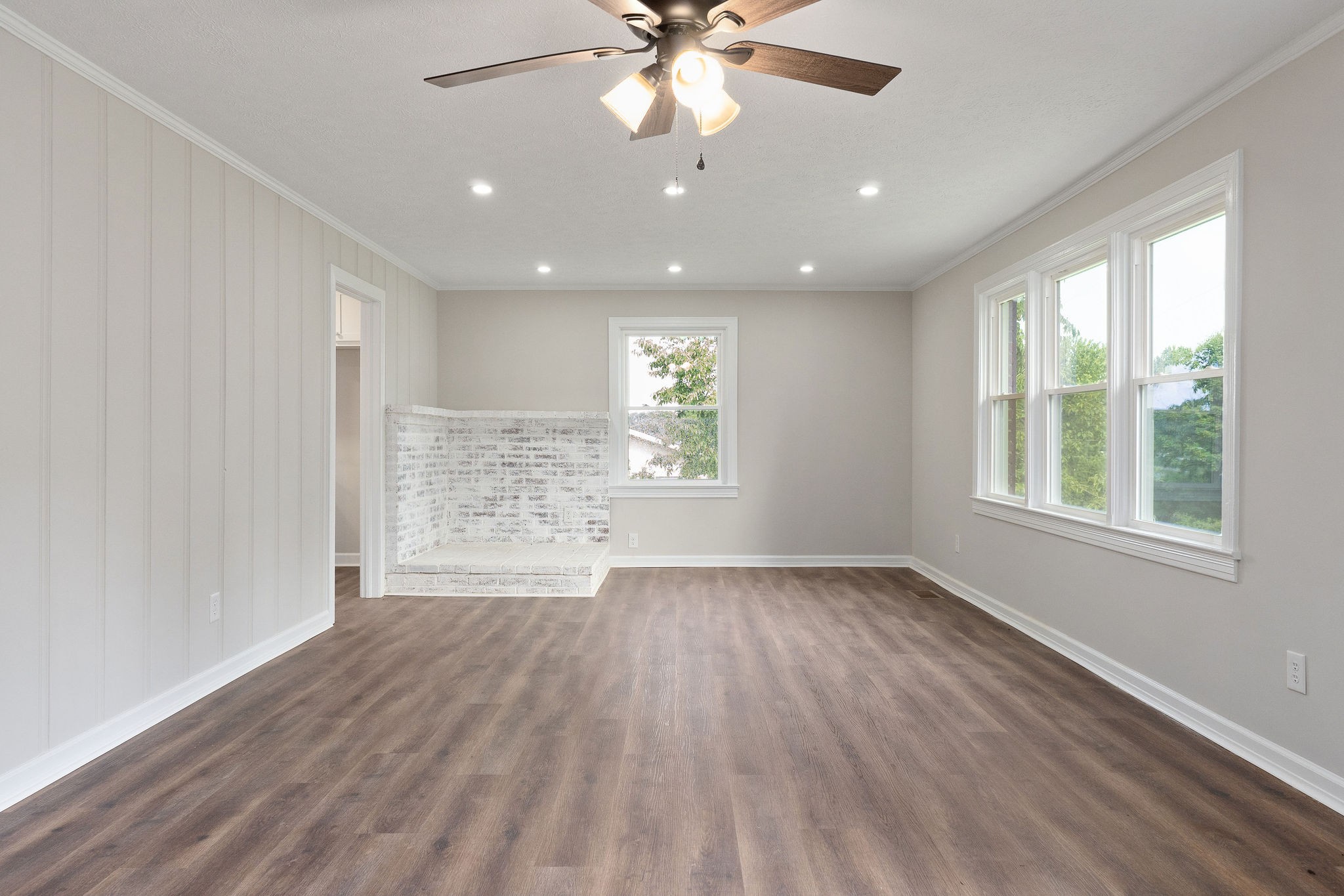 218 Roosevelt Road McMinnville, TN 37110 - Photo 9 of 31 a view of an empty room with a window and wooden floor