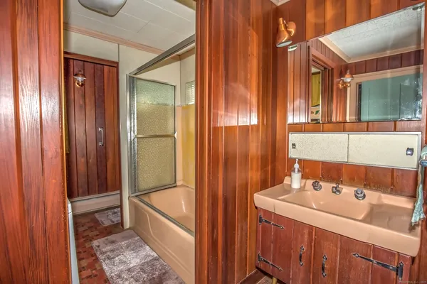 a bathroom with a tub and a sink