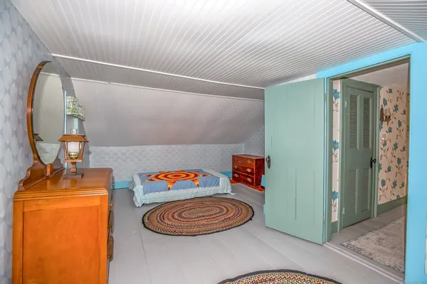 a room with furniture and a mirror