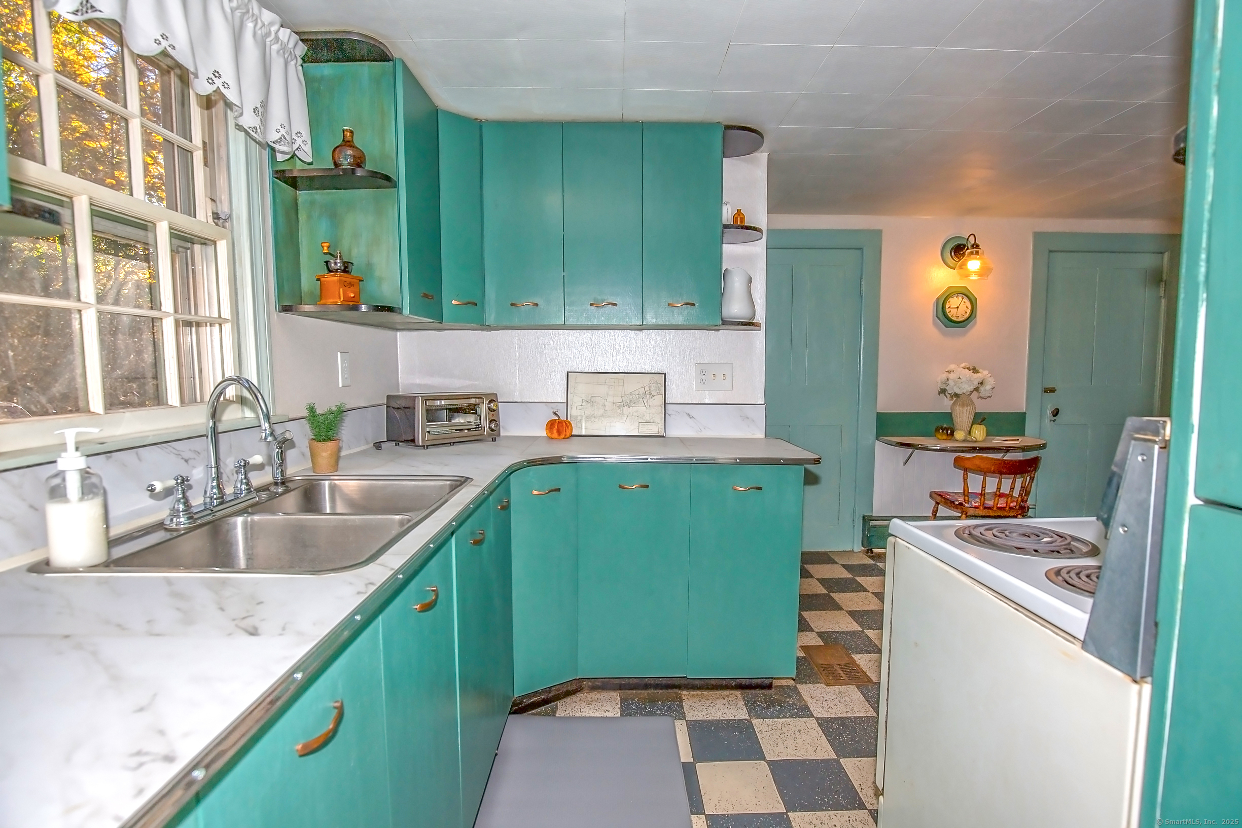 58 Maple Street Ellington, CT 06029 - Photo 30 of 55 a kitchen with a sink and a stove top oven