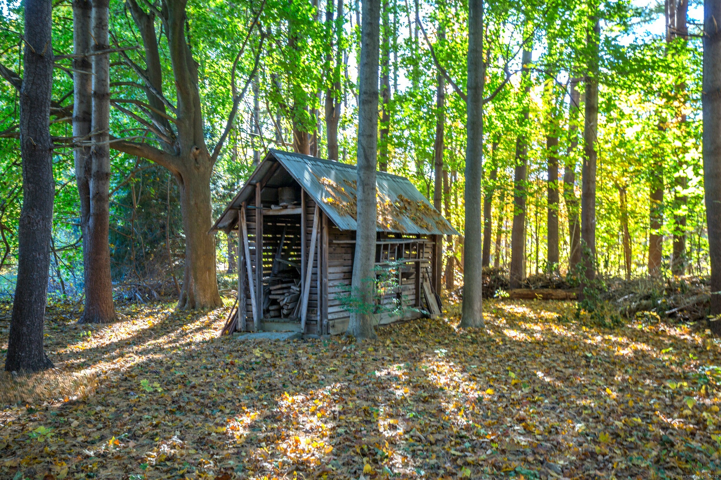 58 Maple Street Ellington, CT 06029 - Photo 47 of 55 The classic corn crib, though no longer in use, stands as a charming nod to the property's farming heritage.