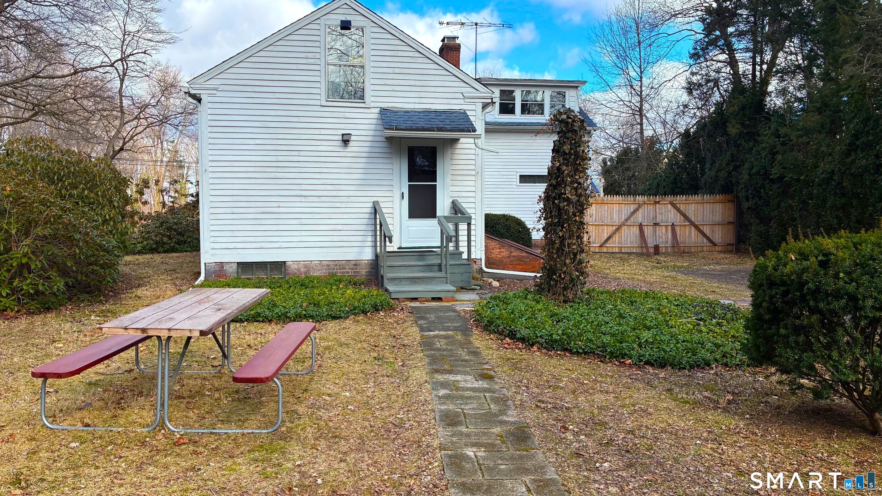 58 Maple Street Ellington, CT 06029 - Photo 7 of 55 a view of a chair and table in backyard