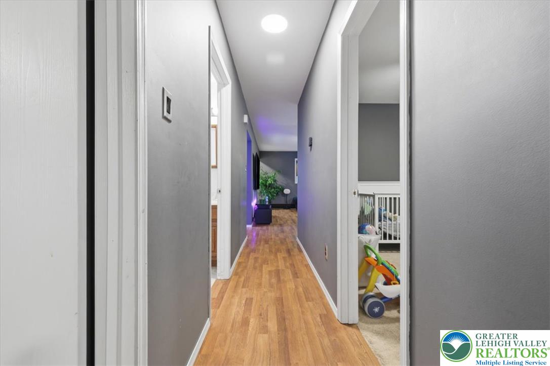 520 Highland Hill Road Jim Thorpe, PA 18235 - Photo 38 of 83 Streamlined hallway with durable hardwood-style flooring leading to private quarters.