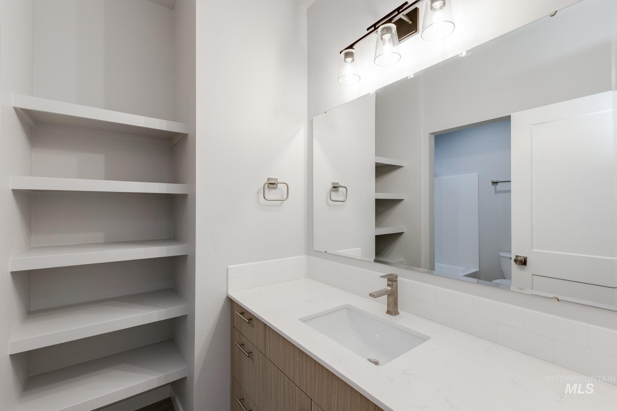 6558 South Sunfish Avenue Boise, ID 83709 - Photo 28 of 32 Bathroom with vanity and toilet