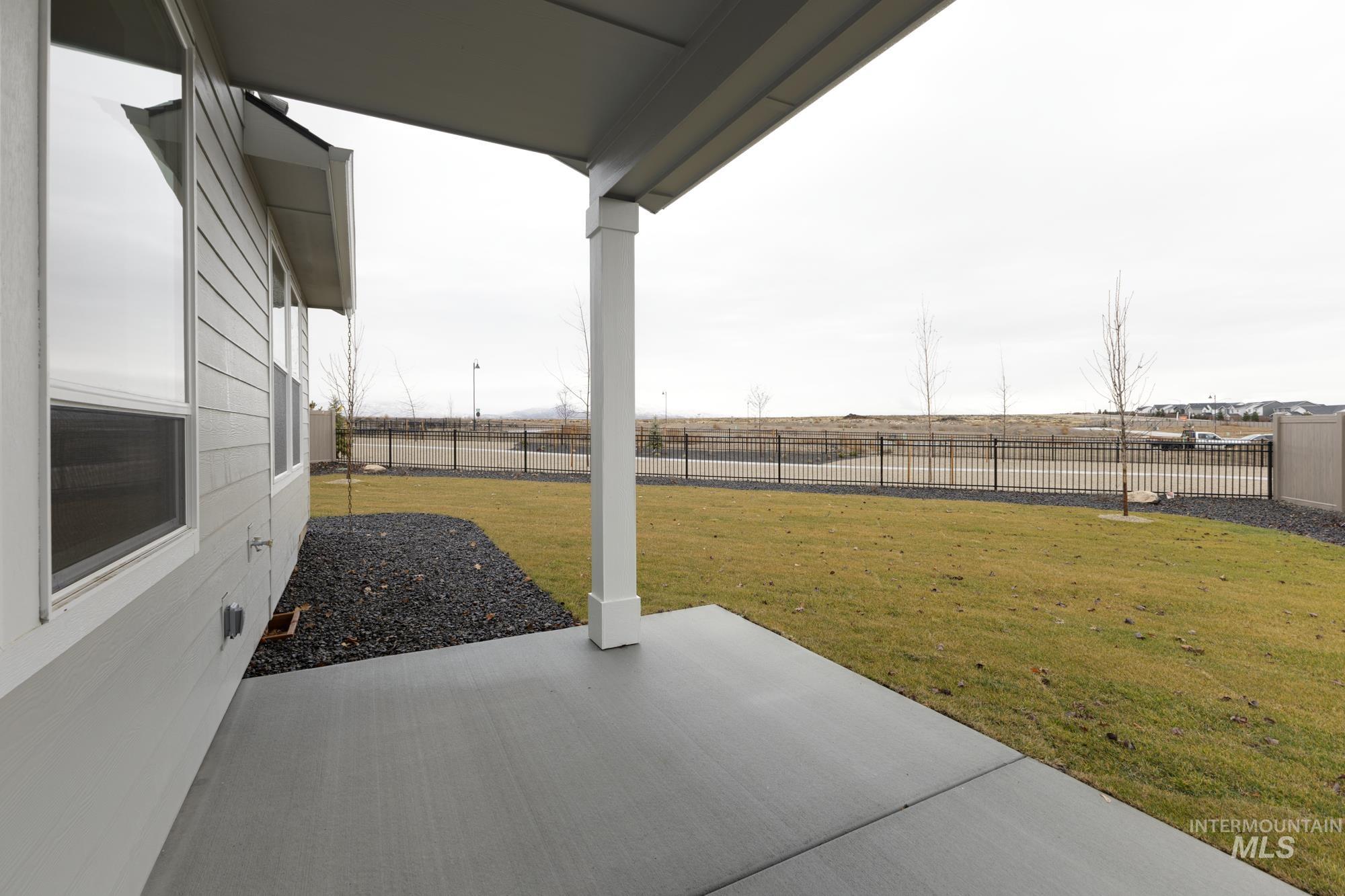 6558 South Sunfish Avenue Boise, ID 83709 - Photo 30 of 32 Fenced backyard with a patio