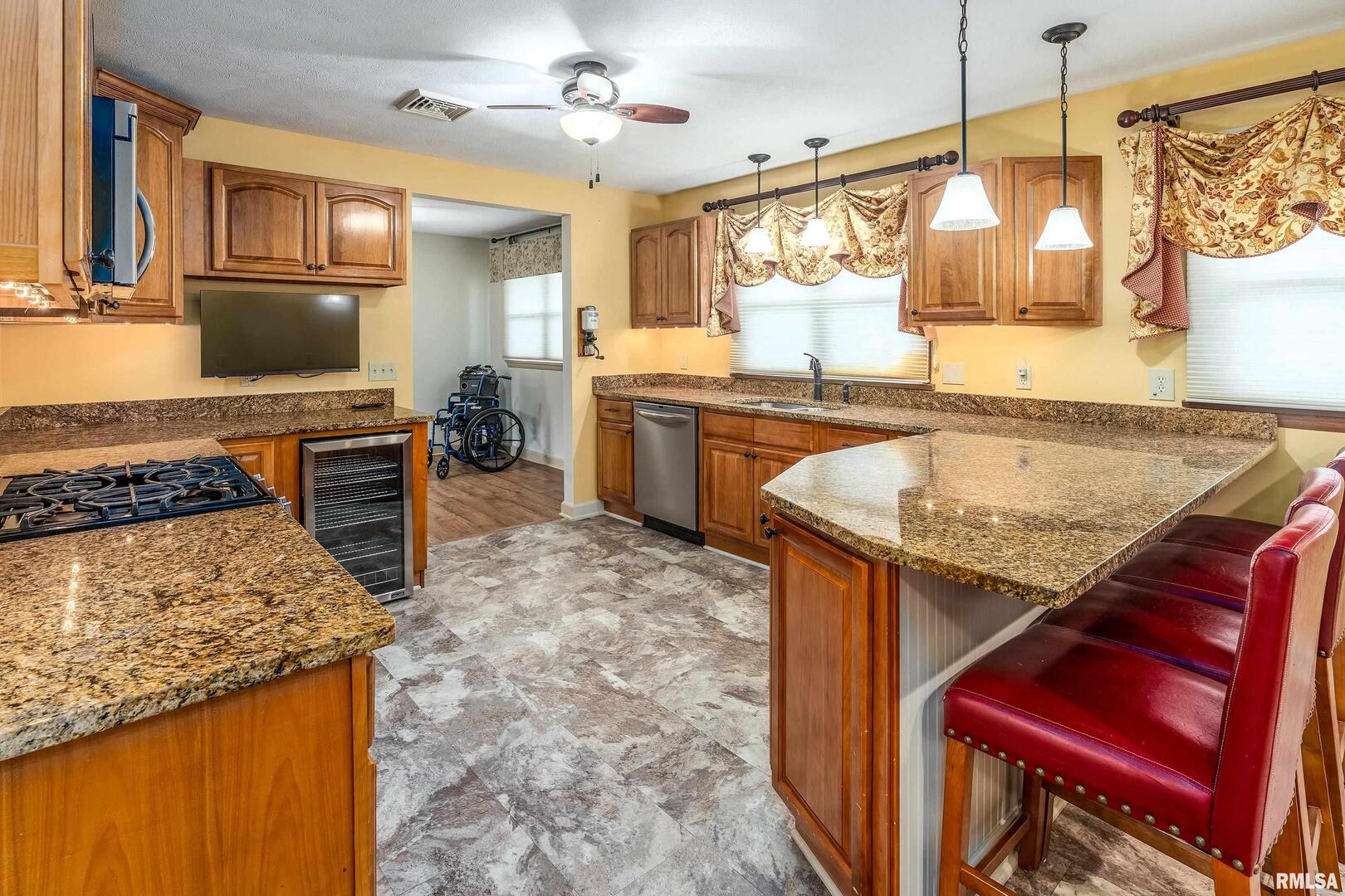 9784 Highway 127 Murphysboro, IL 62966 - Photo 18 of 60 a kitchen with stove top oven and refrigerator
