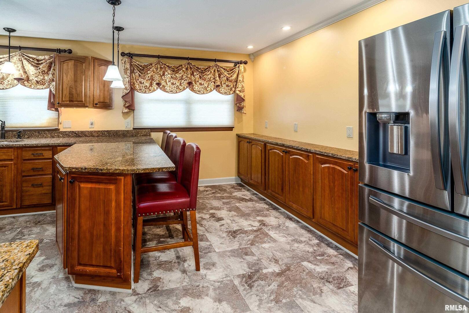 9784 Highway 127 Murphysboro, IL 62966 - Photo 19 of 60 a kitchen with stainless steel appliances granite countertop a refrigerator a stove and a sink