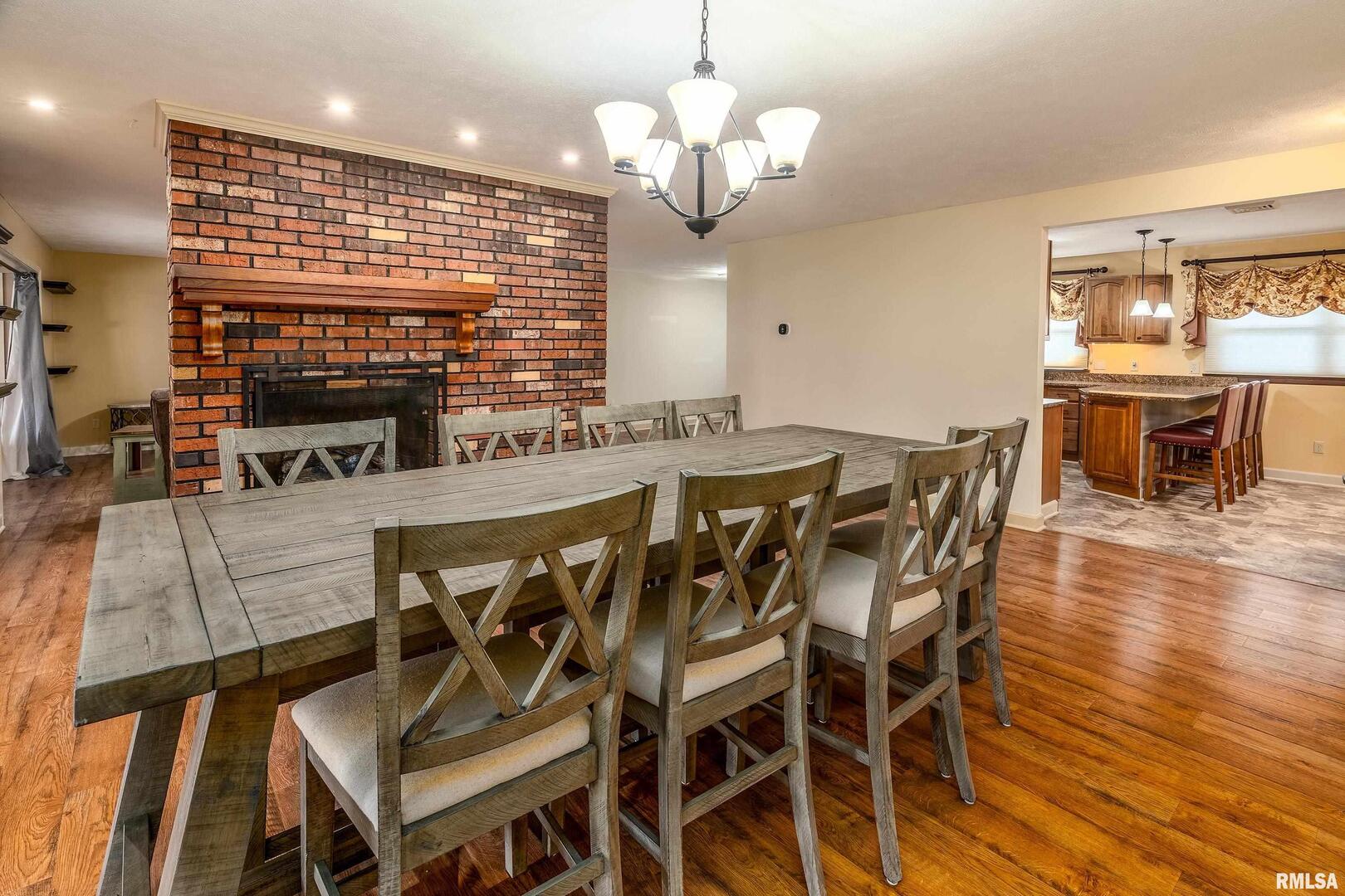 9784 Highway 127 Murphysboro, IL 62966 - Photo 21 of 60 a view of a dining room with furniture window and wooden floor