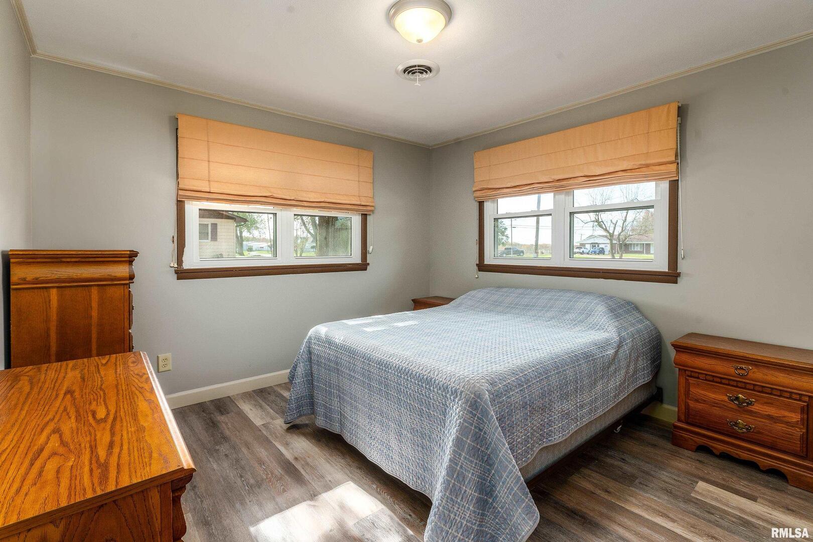 9784 Highway 127 Murphysboro, IL 62966 - Photo 31 of 60 a bedroom with a bed and wooden floor