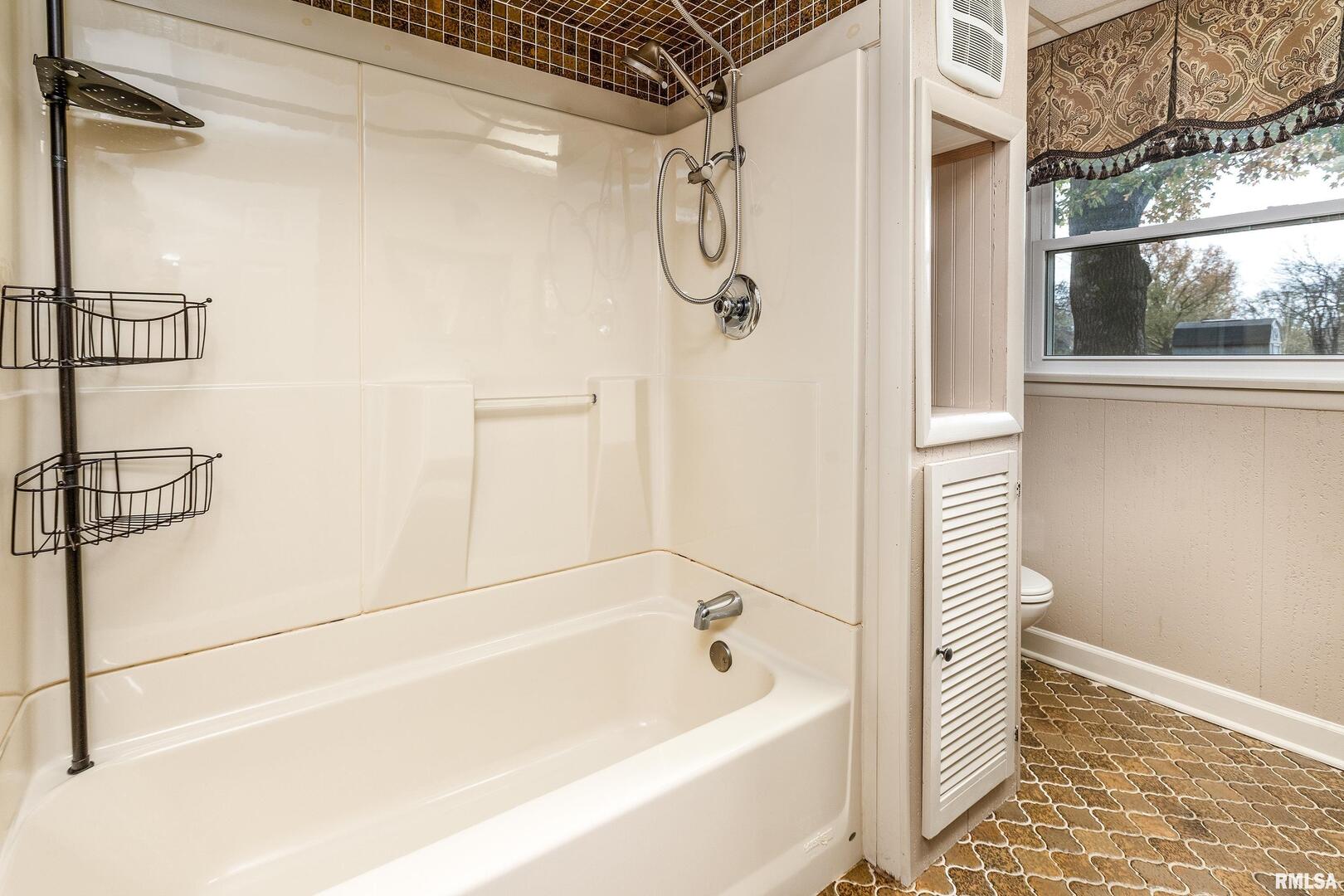 9784 Highway 127 Murphysboro, IL 62966 - Photo 34 of 60 a bathroom with a bathtub and a shower