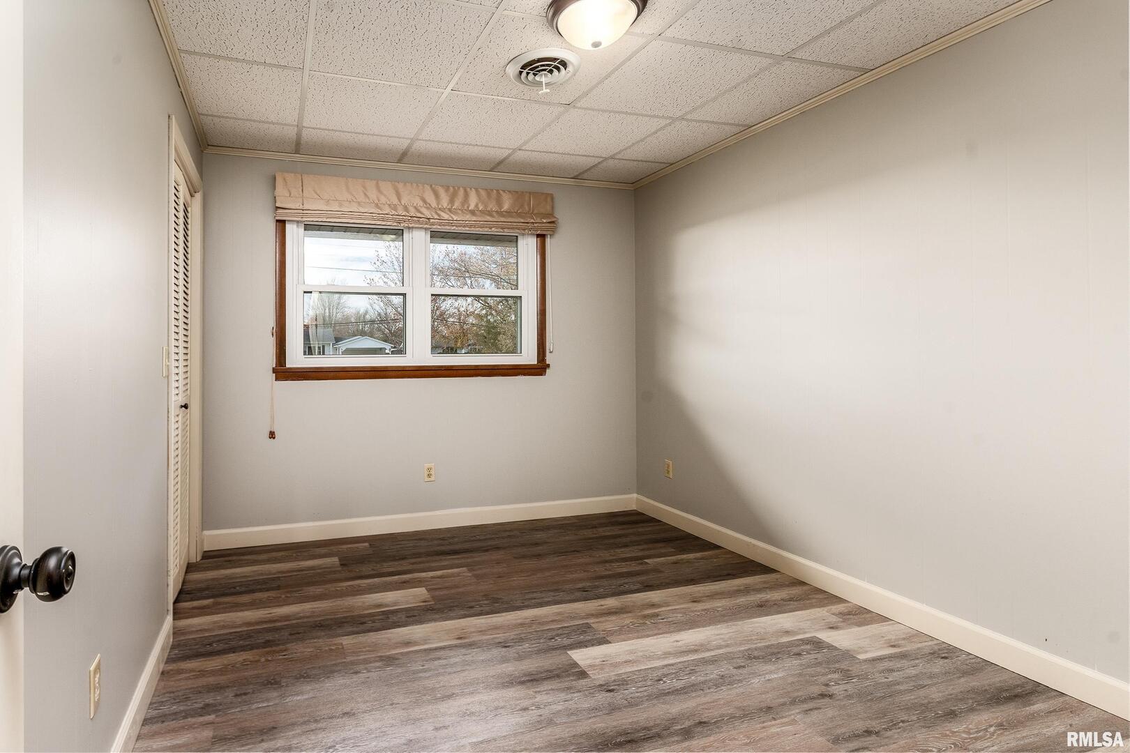 9784 Highway 127 Murphysboro, IL 62966 - Photo 35 of 60 a view of empty room with wooden floor and fan