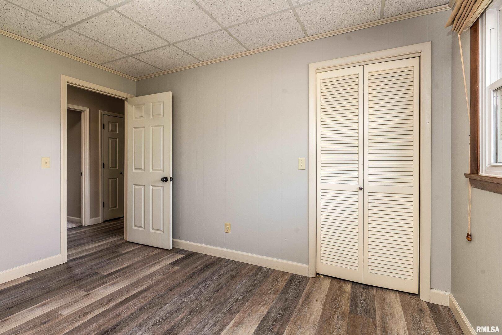 9784 Highway 127 Murphysboro, IL 62966 - Photo 36 of 60 an empty room with wooden floor and windows