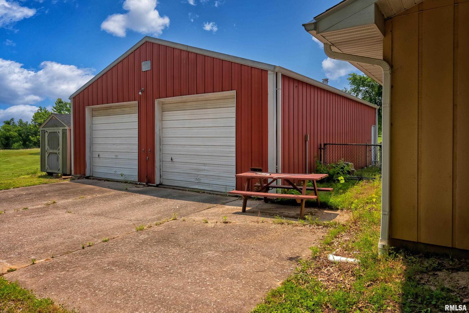 9784 Highway 127 Murphysboro, IL 62966 - Photo 48 of 60 a backyard of a house with a table and chairs